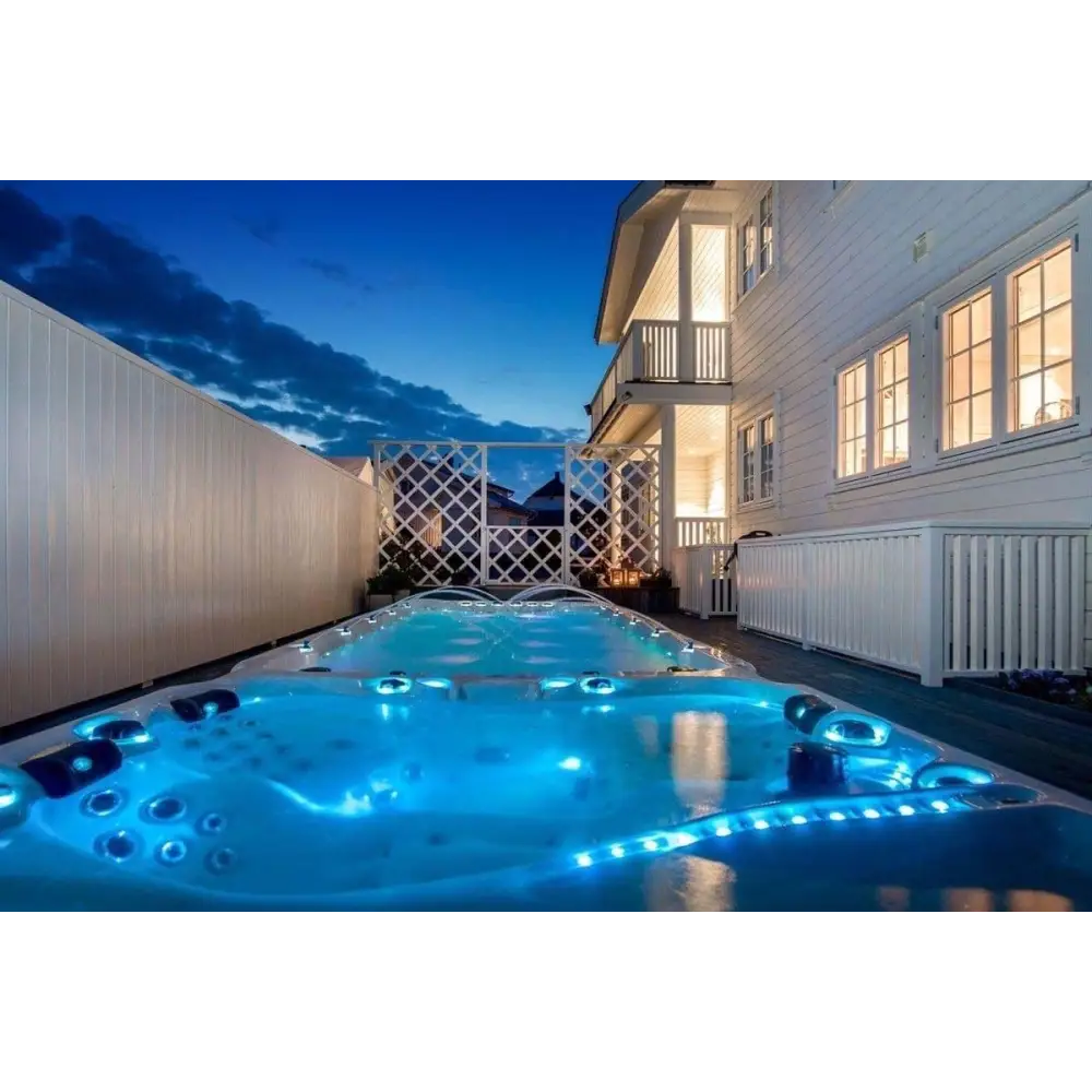 Blå upplyst PassionSpa Energy Swim Spa med svarta jetstrålar, Sport Collection