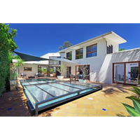 Modern vit villa med Mästare Plus 4x8 glaspooltäckning och års garanti